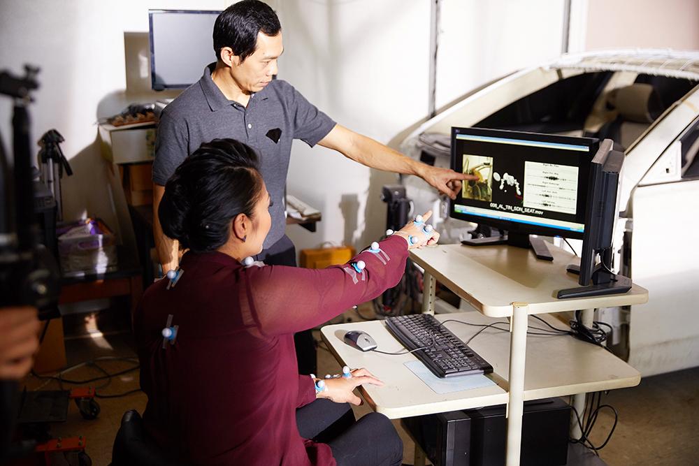 Two innovators work at a computer